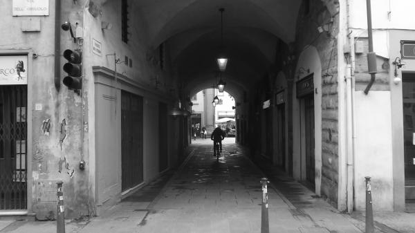 Arco di San Piero e ciclista solitario / St Peter's Arch and a lonely bicyclist.