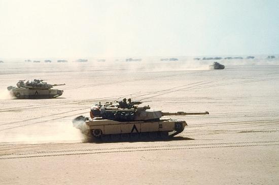 Abrams tanks move out on a mission during Desert Storm in 1991