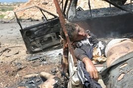 Palestinian Boy in Burned Out Car